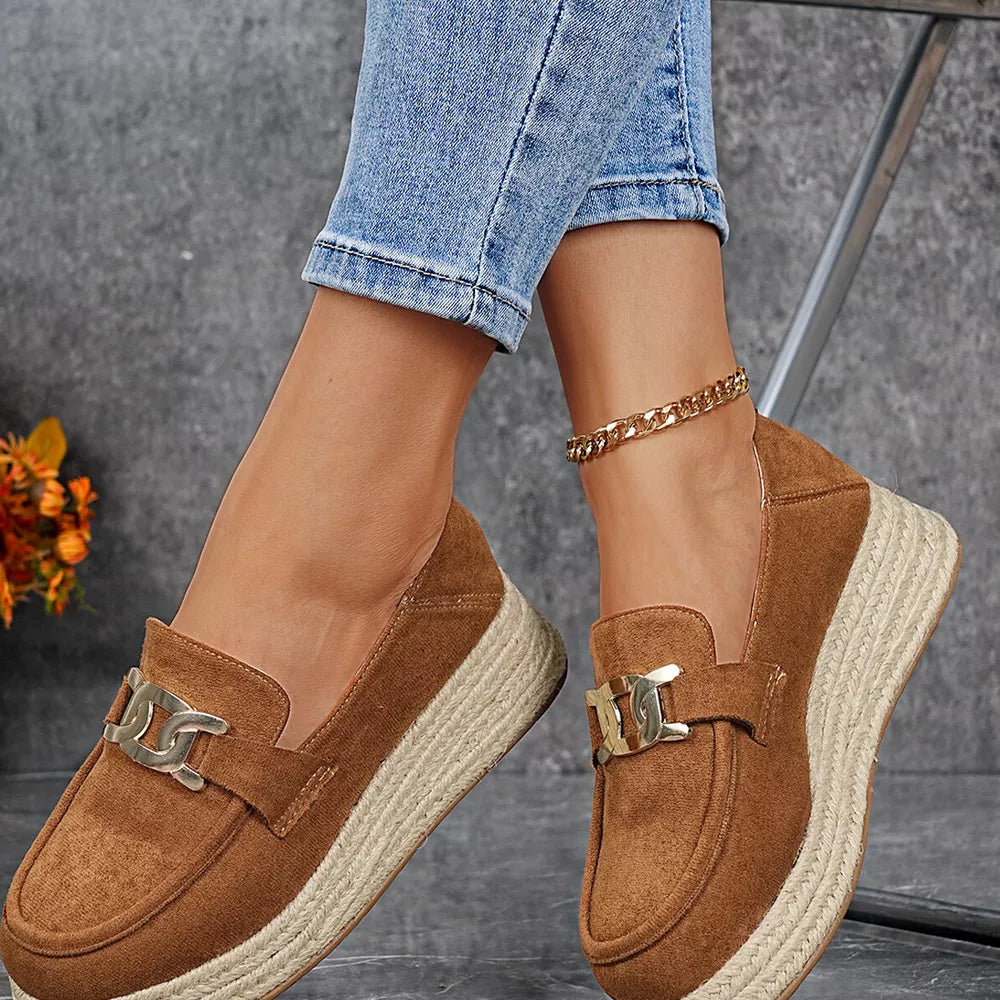 Chic brown round toe platform loafers with decorative buckle and espadrille sole.