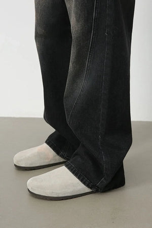 Faded wash wide leg denim jeans in dark, shown with a relaxed fit.
