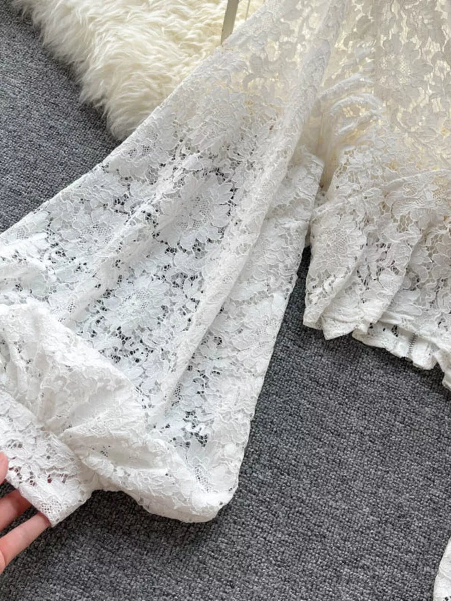 White sheer floral lace shirt with balloon sleeves and tie-back detail.