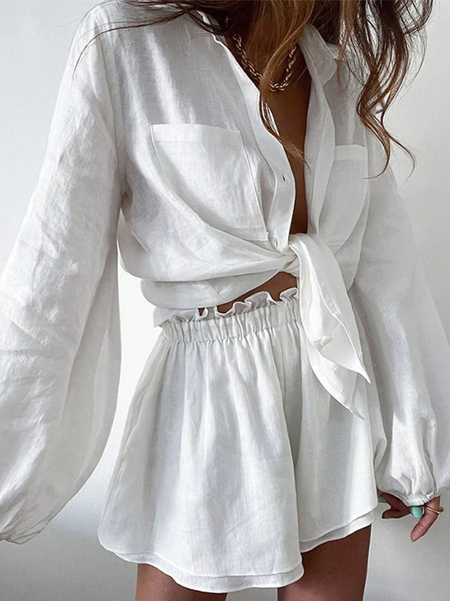 White linen two-piece set with tie-front shirt and ruffled waist shorts