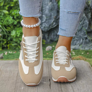 light gray sneakers featuring round toe and color-block
