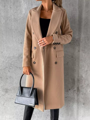 Chic double-breasted longline trench coat in apricot with button details.