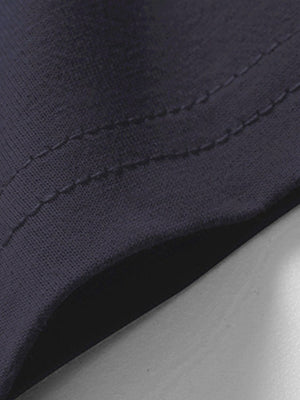 Blue cotton t-shirt detail showing stitching and fabric texture.