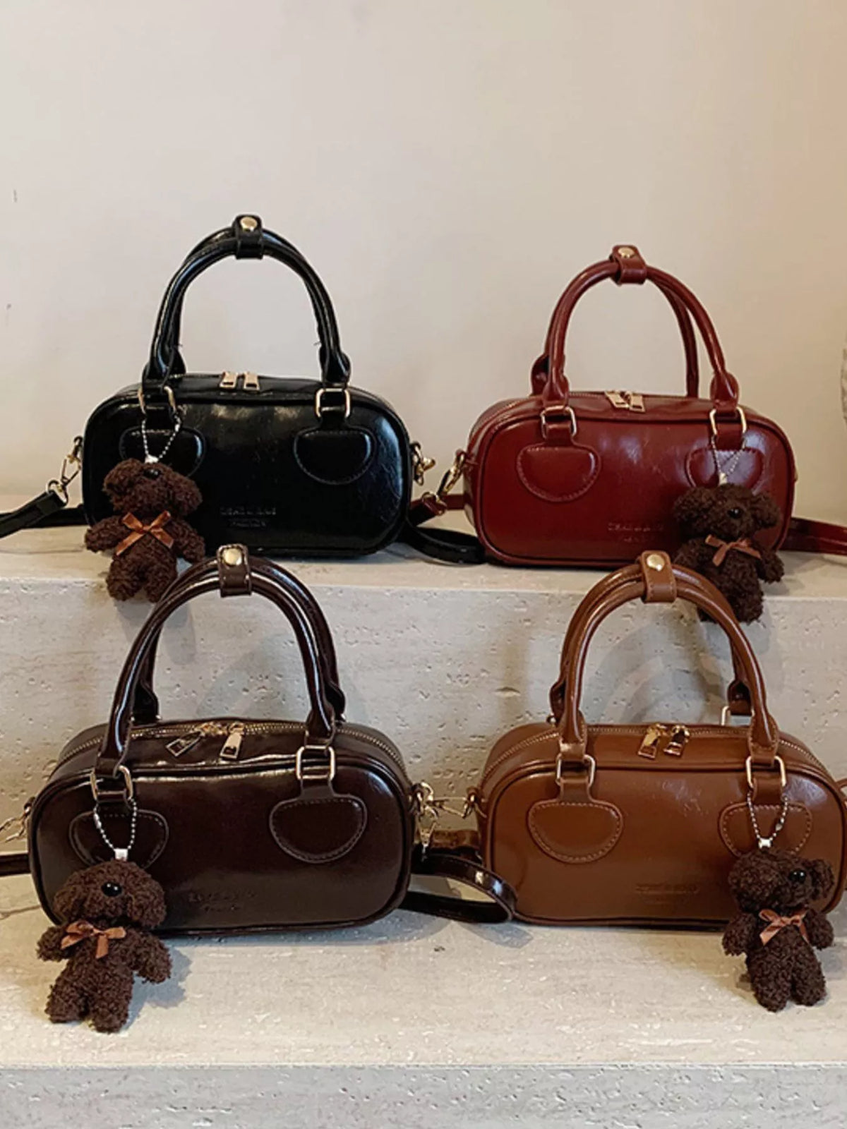 Chic mini PU leather crossbody bag in black, deep red, chocolate, and terracotta with teddy bear charm