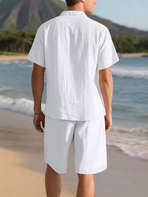 White men's casual short sleeve shirt and shorts ensemble on beach