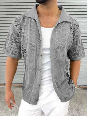 Gray open-knit resort shirt with short sleeves and a collar, styled with a white tank top.