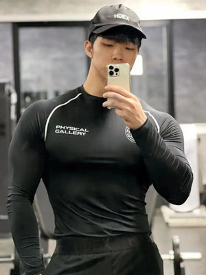 Black crew neck long sleeve activewear top with white piping and chest branding.