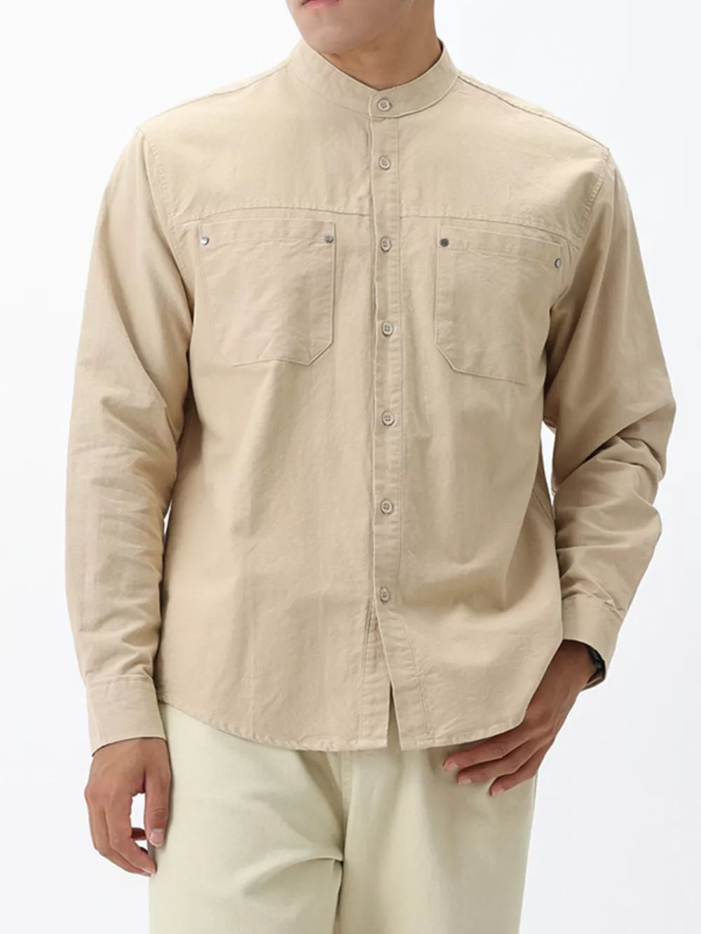 Apricot cotton casual long sleeve shirt with button-down front and two chest pockets.
