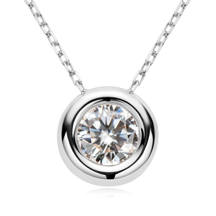 Silver solitaire pendant necklace with bezel-set diamond on a delicate chain.