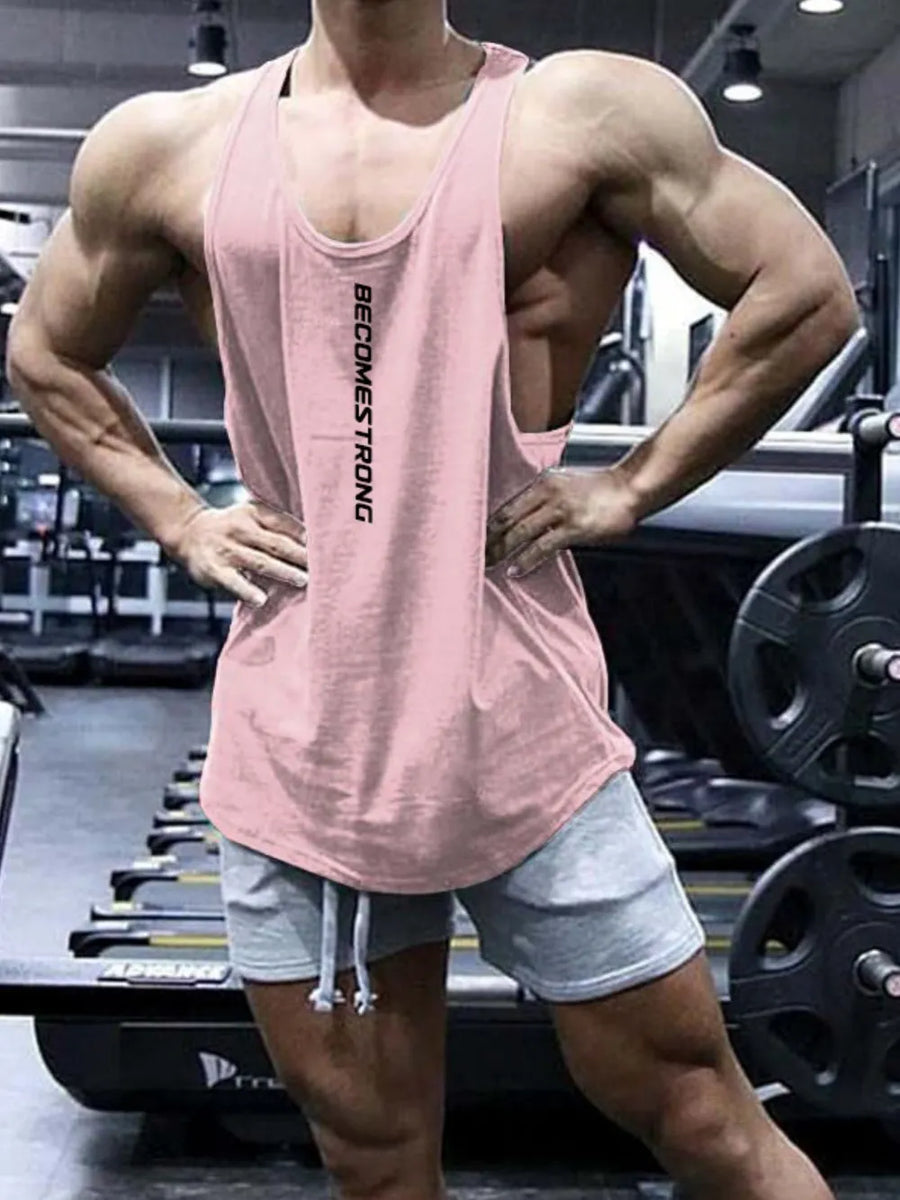 Blush pink slub tank top with vertical text detail, worn by a man in a gym.