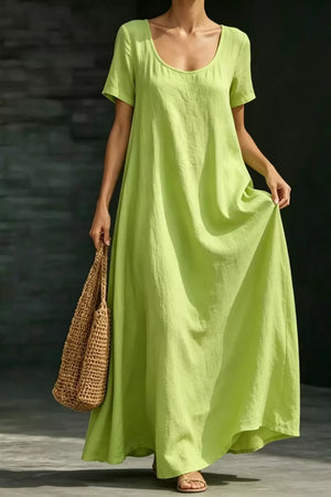 Lime maxi dress with short sleeves, scoop neck, and pockets, made of 100% polyester.