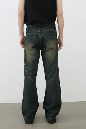Dark wash bootcut jeans with faded seam details and a relaxed fit.