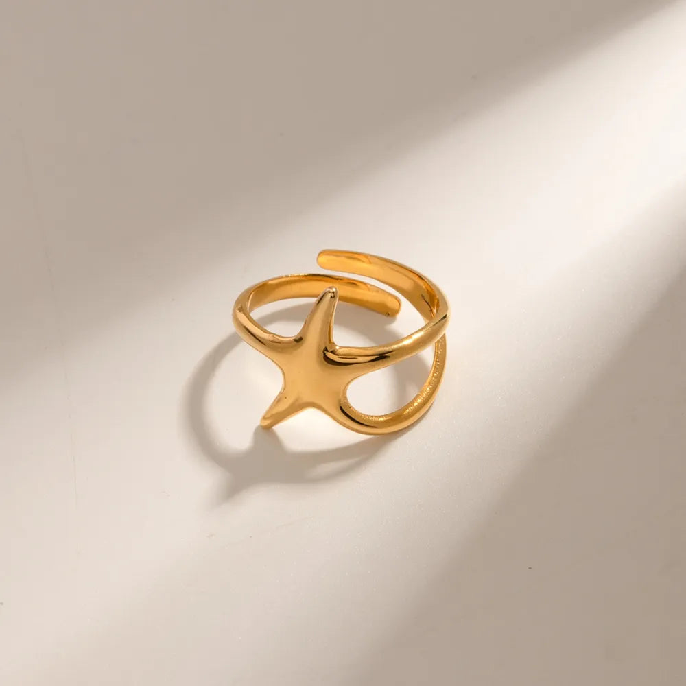 Gold adjustable ring with a starfish silhouette detail