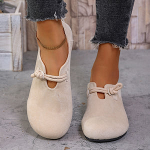 Beige matte fabric round toe flats with cord detail and a cutout.