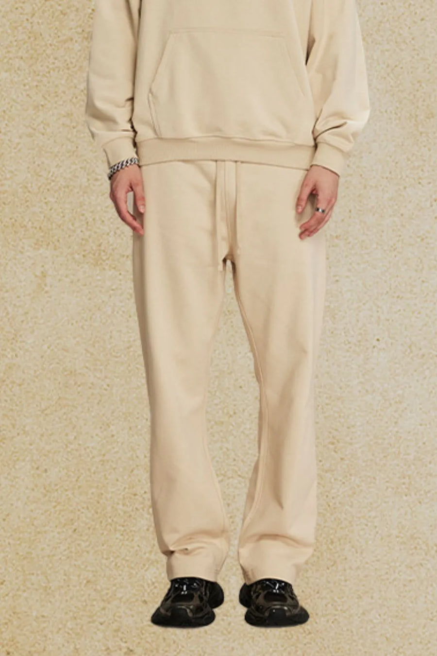 Relaxed fit tan joggers with drawstring waist and cuffed ankles.