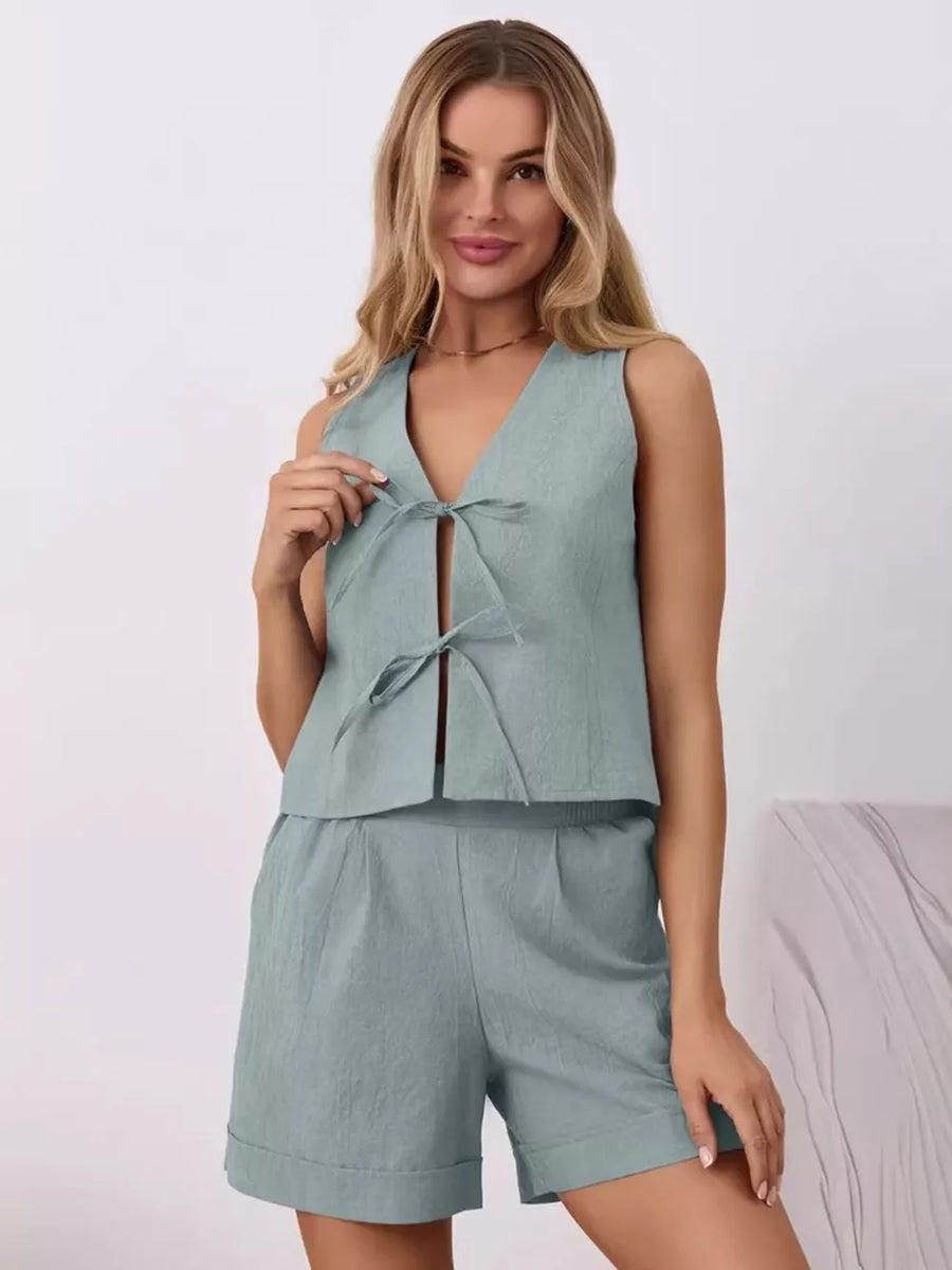Blue cotton tie-front sleeveless top and cuffed shorts set.