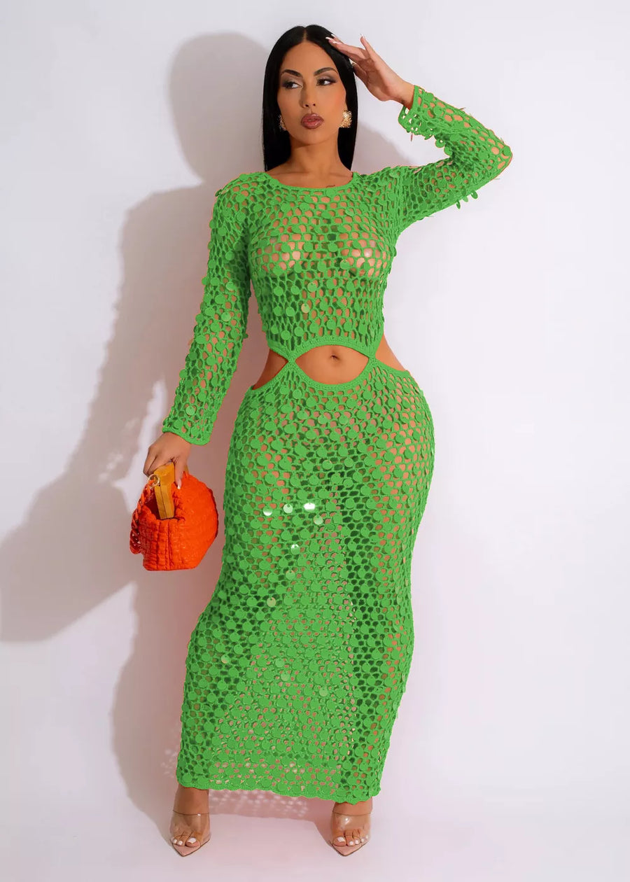 Green mesh cutout maxi dress with long sleeves and sequin details.