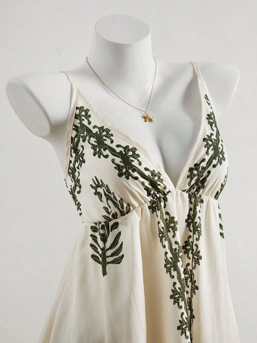 dark green mini dress featuring smocked and botanical-print