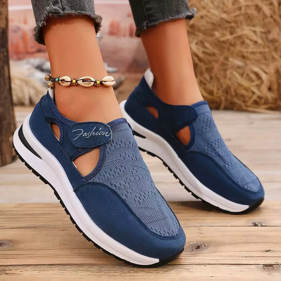 Blue cutout slip-on sneakers with white soles and a "Fashion" detail.