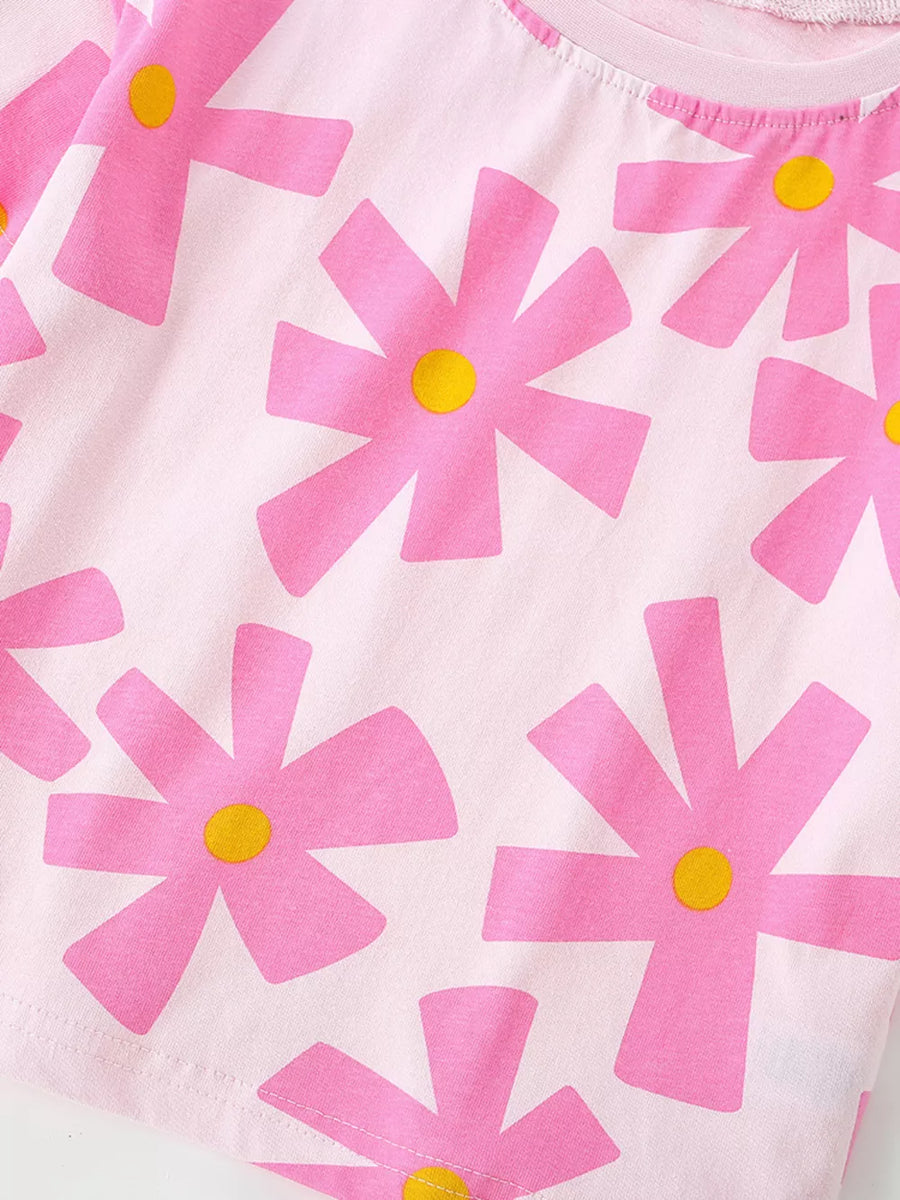 Pink cotton t-shirt for baby girls with a whimsical pink flower print and yellow centers.