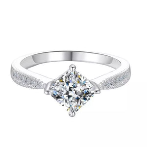 Sterling silver ring with princess-cut moissanite and pave band.