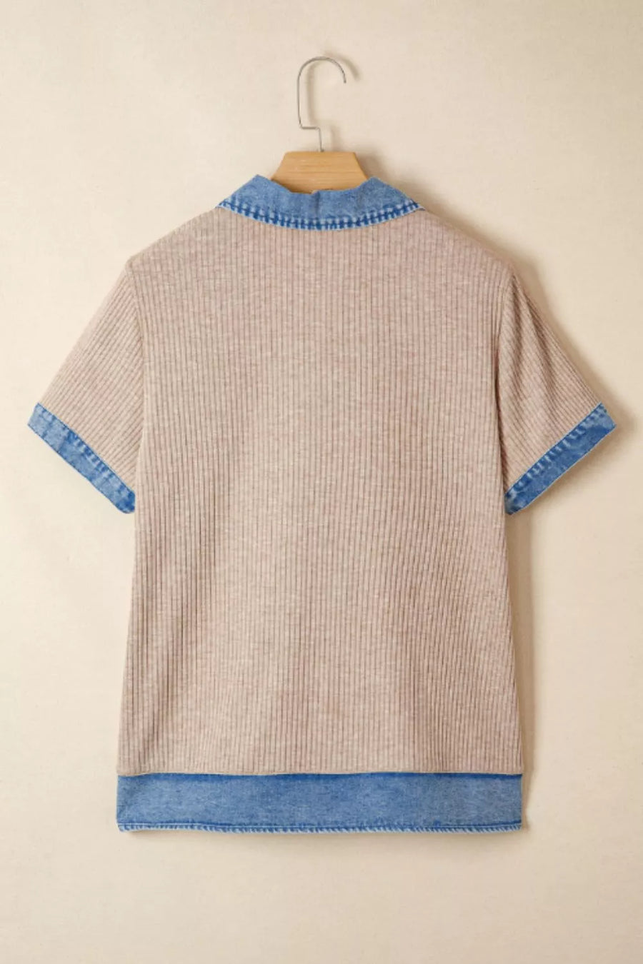 Ribbed knit tunic top in beige with a denim collar, short sleeves, and hem detail.