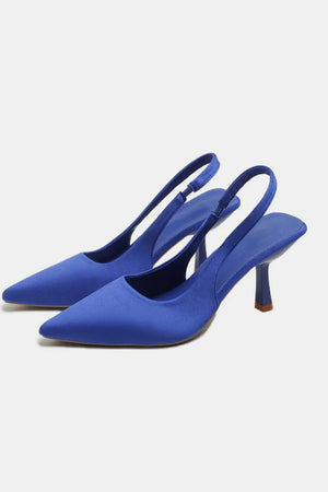 Royal blue satin slingback pumps with sculpted heels and pointed toes.