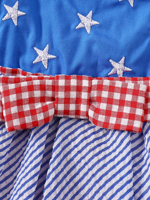 Patriotic baby dress with blue star top, red gingham bow, and blue striped skirt.