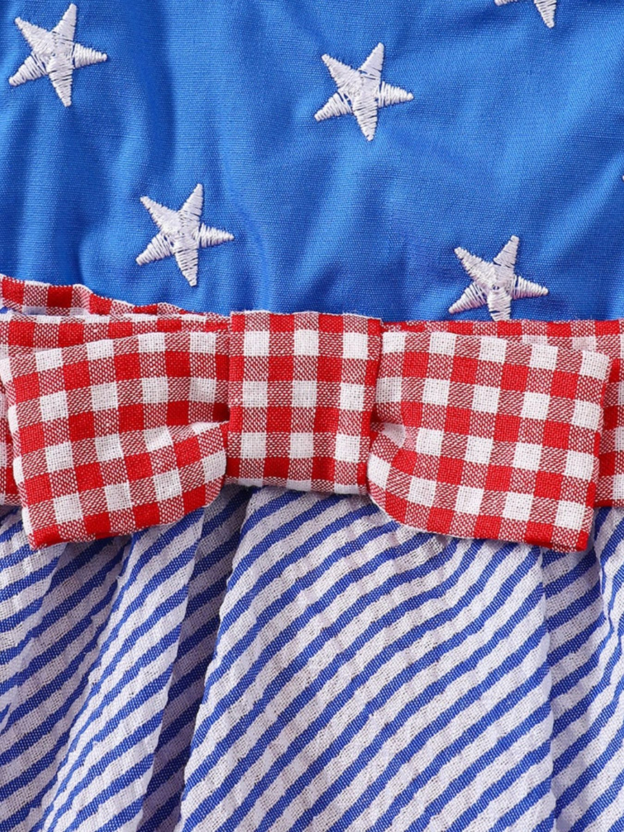 Patriotic baby dress with blue star top, red gingham bow, and blue striped skirt.
