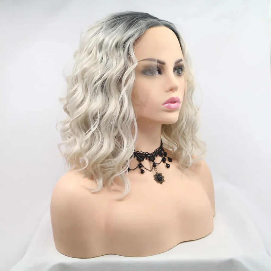 Ombre wave bob wig in black and white with loose curls and a lace front.