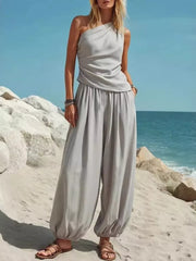 Gray one-shoulder top and wide-leg pants set with gathered ankles.