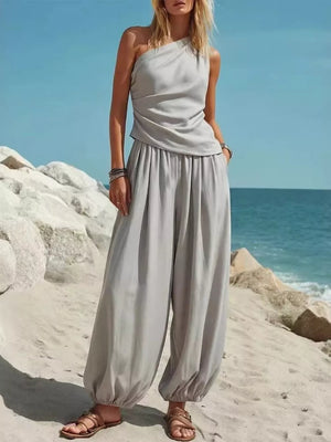 Gray one-shoulder top and wide-leg pants set with gathered ankles.