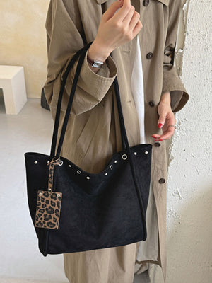 tote in black with studded and large