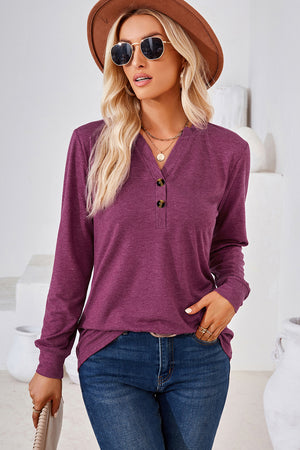 Henley button-down knit top in plum with a V-neck and two dark buttons.
