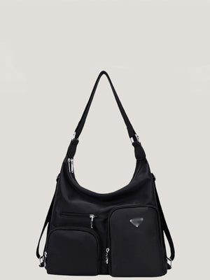 Black nylon shoulder bag with multiple exterior pockets and silver hardware.