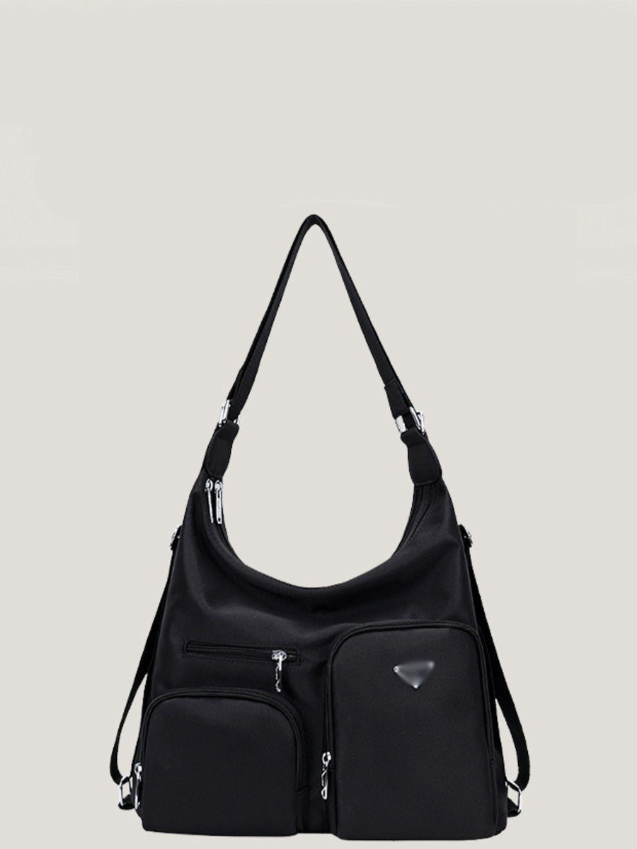 Black nylon shoulder bag with multiple exterior pockets and silver hardware.