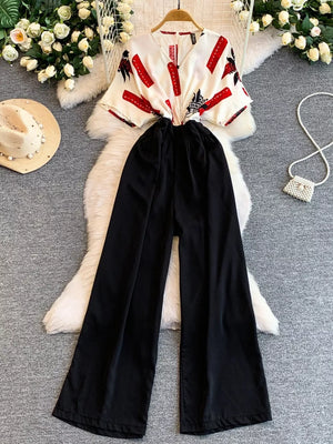 Abstract print white romper with black wide-leg pants and pockets