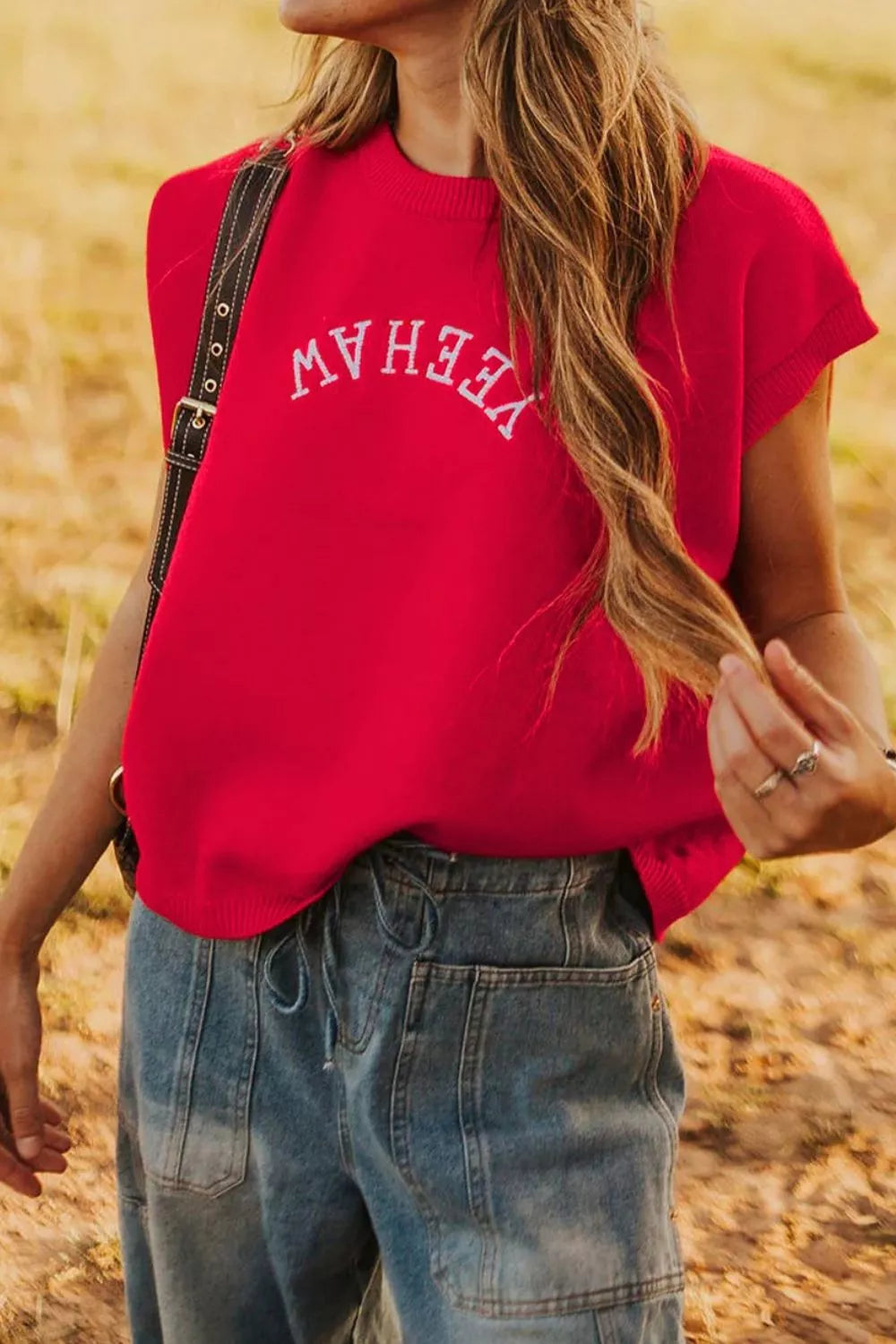 Red crew neck sweater vest with white embroidered "Yeehaw" text, short sleeves