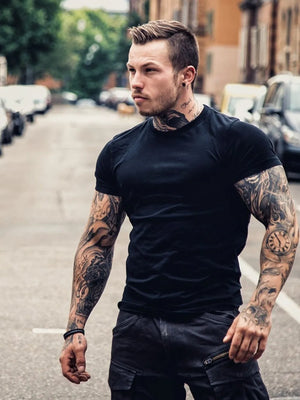 Black crew neck muscle fit tee with short sleeves.