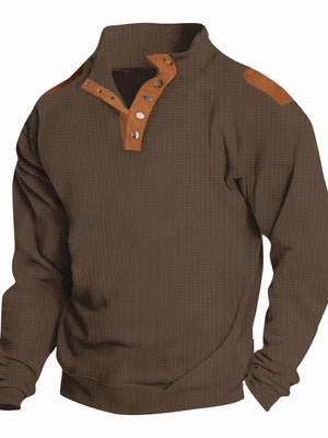 Brown waffle knit henley shirt with suede shoulder patches and button collar detail.