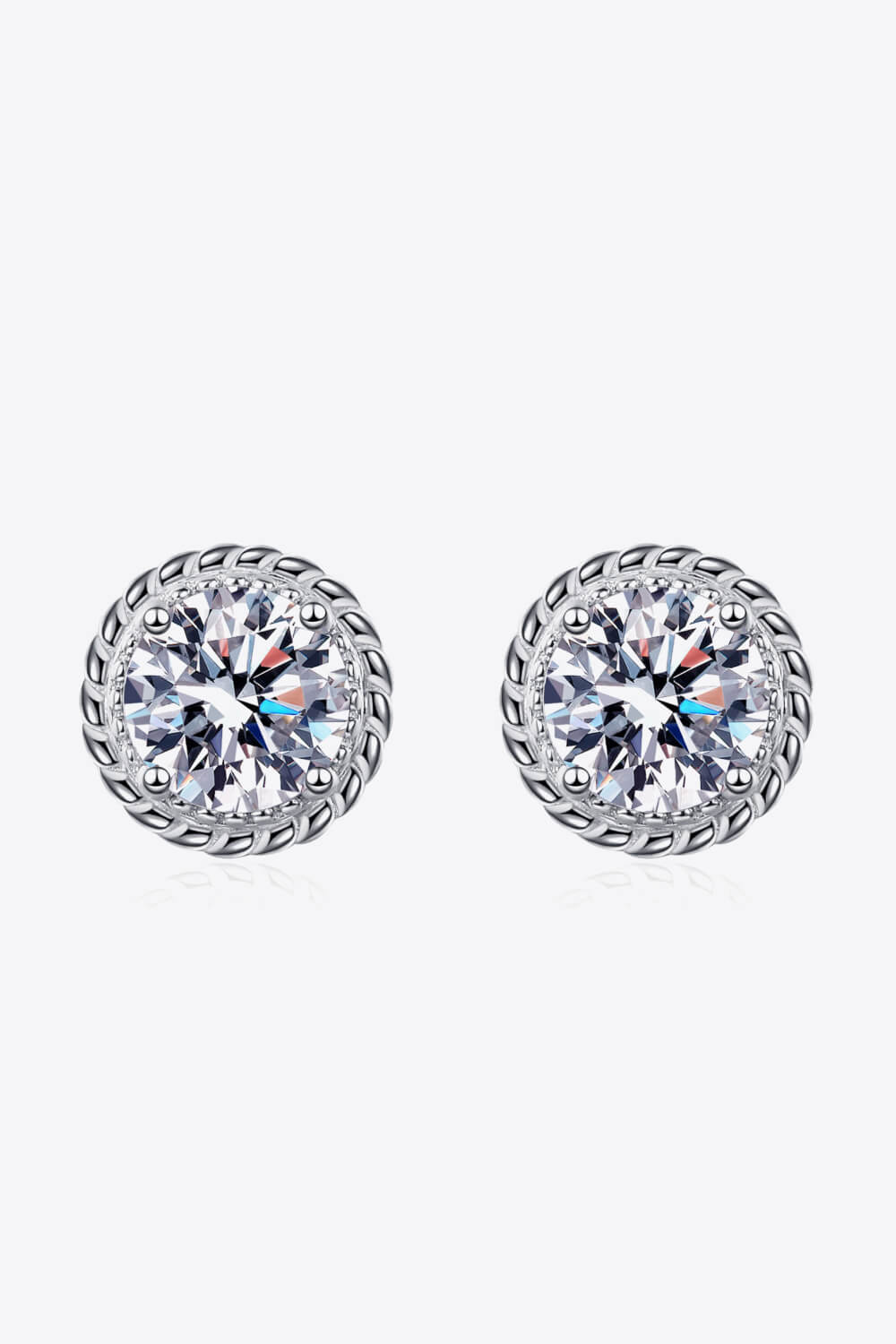 Silver rope-framed moissanite stud earrings with brilliant cut stones.