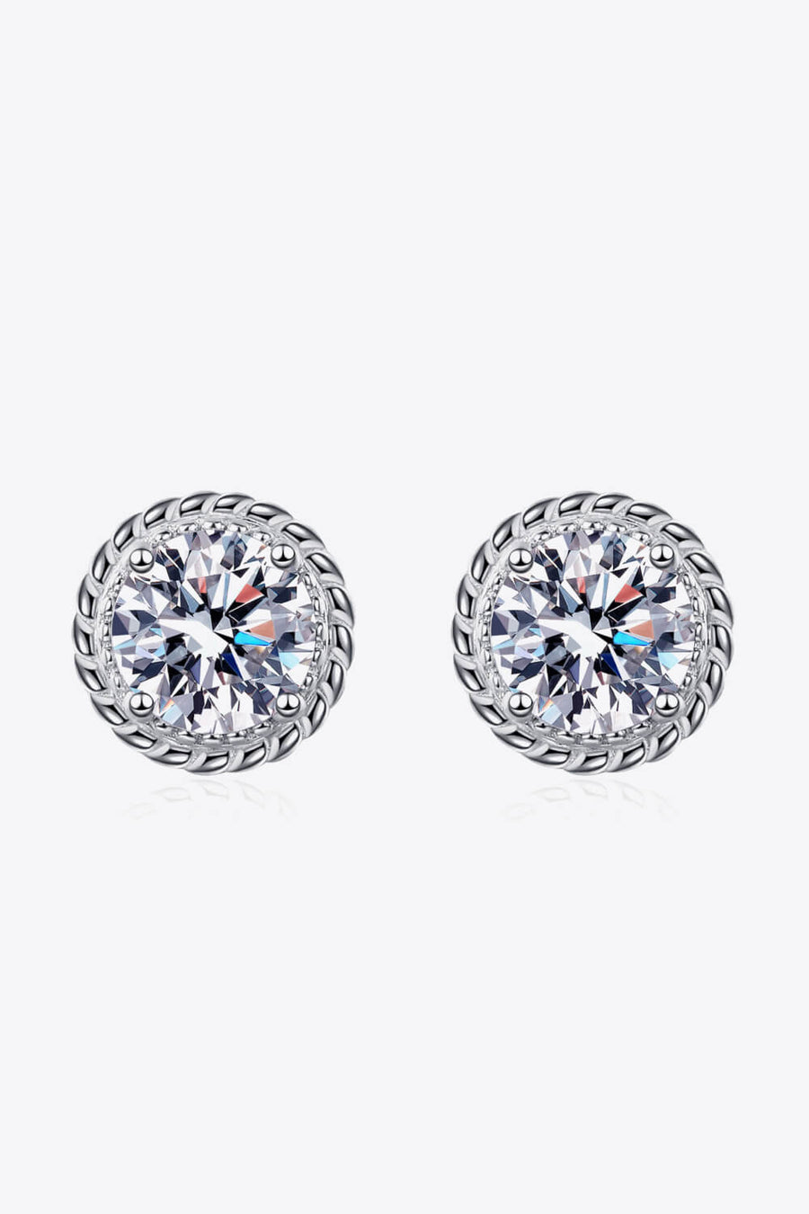Silver rope-framed moissanite stud earrings with brilliant cut stones.