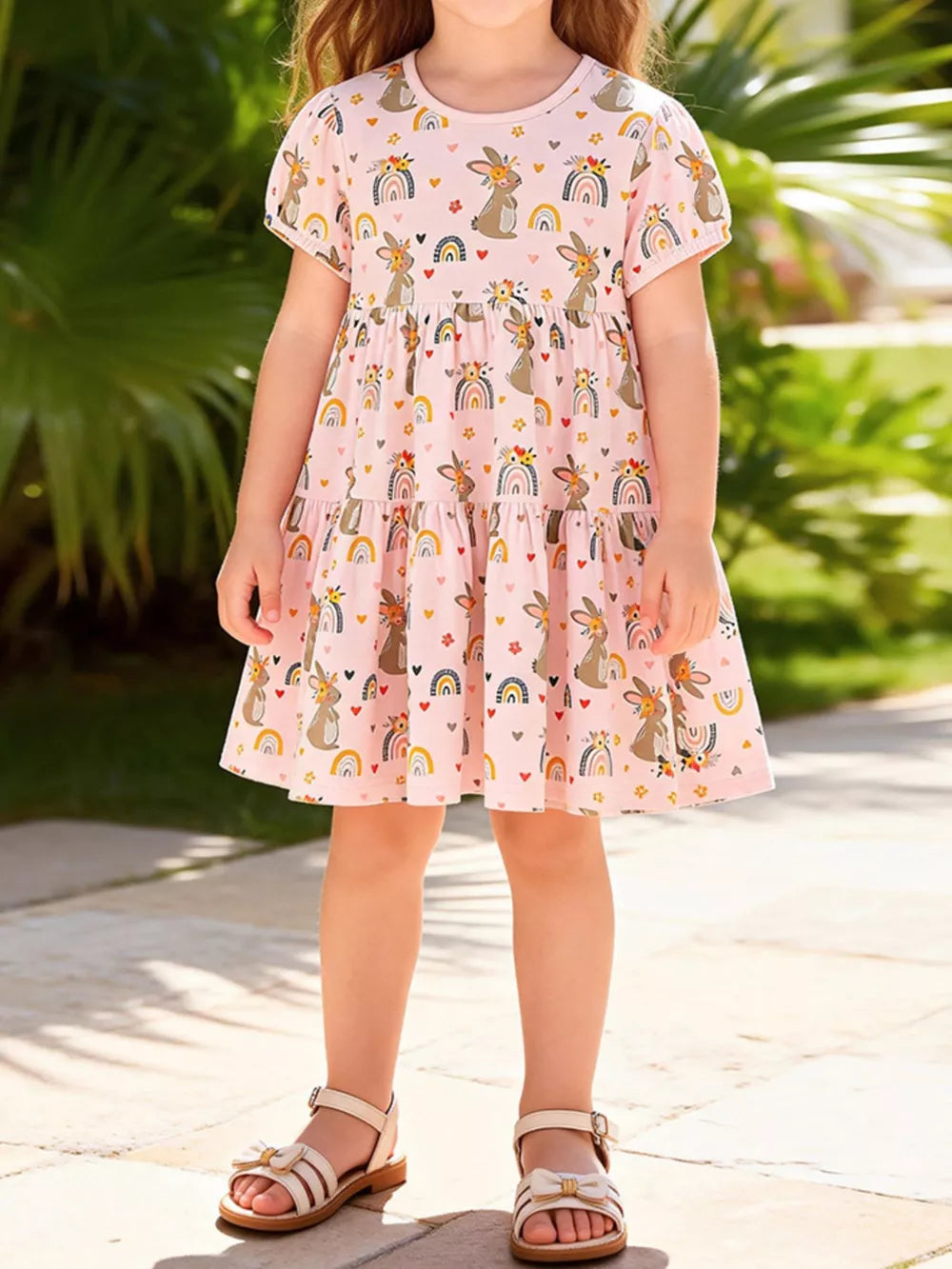 Pink cotton dress with bunnies and rainbows, above knee length, short sleeves.