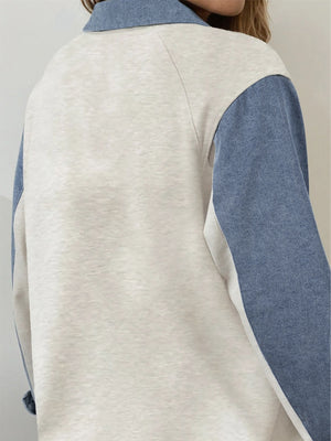 Heathered casual top with color-blocked denim sleeves and collar detail.