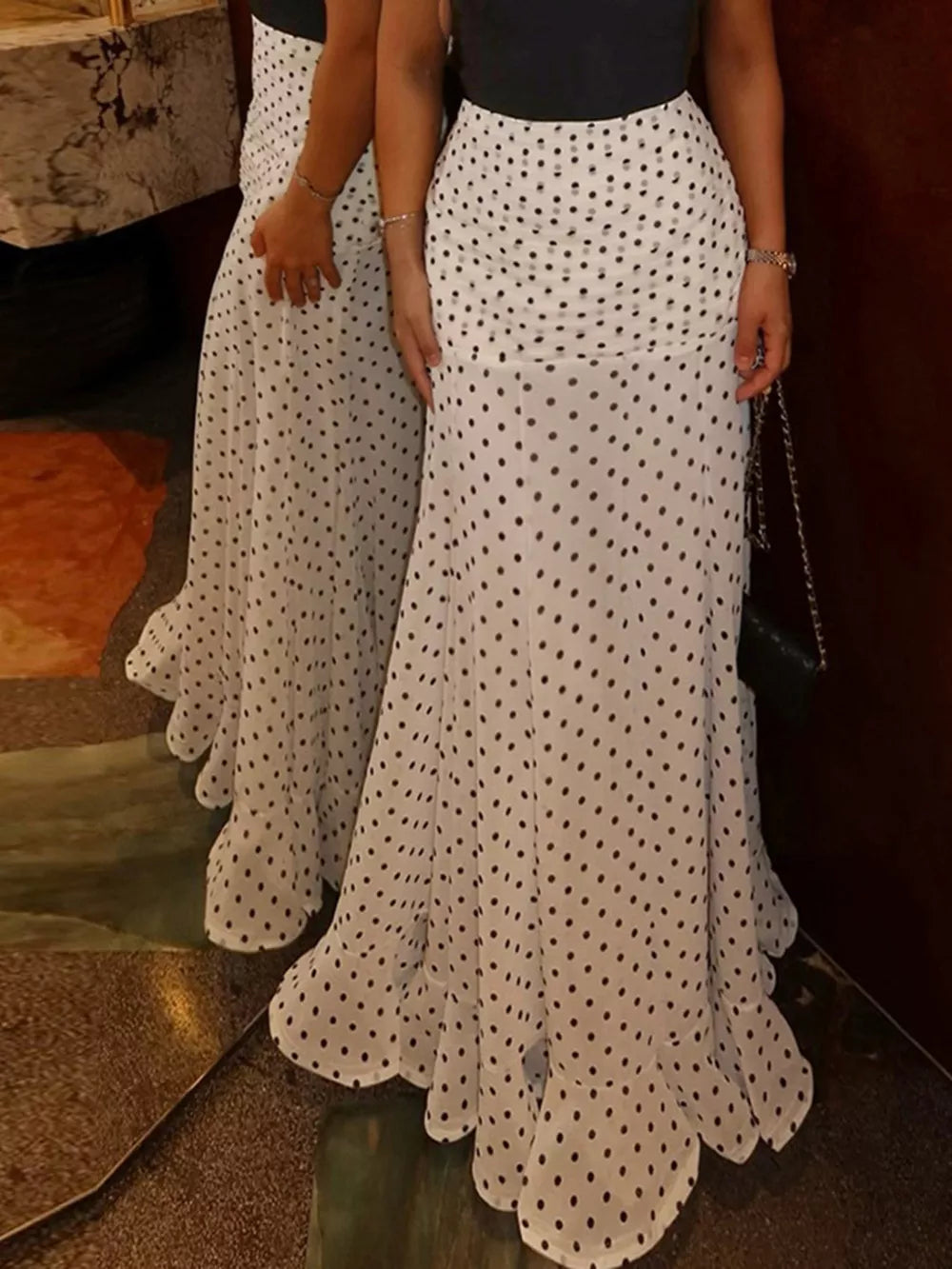 maxi skirt in white featuring ruched and flared fit