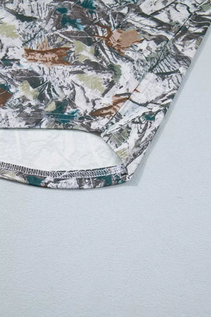 Earthy camouflage print henley t-shirt with a detailed hem.