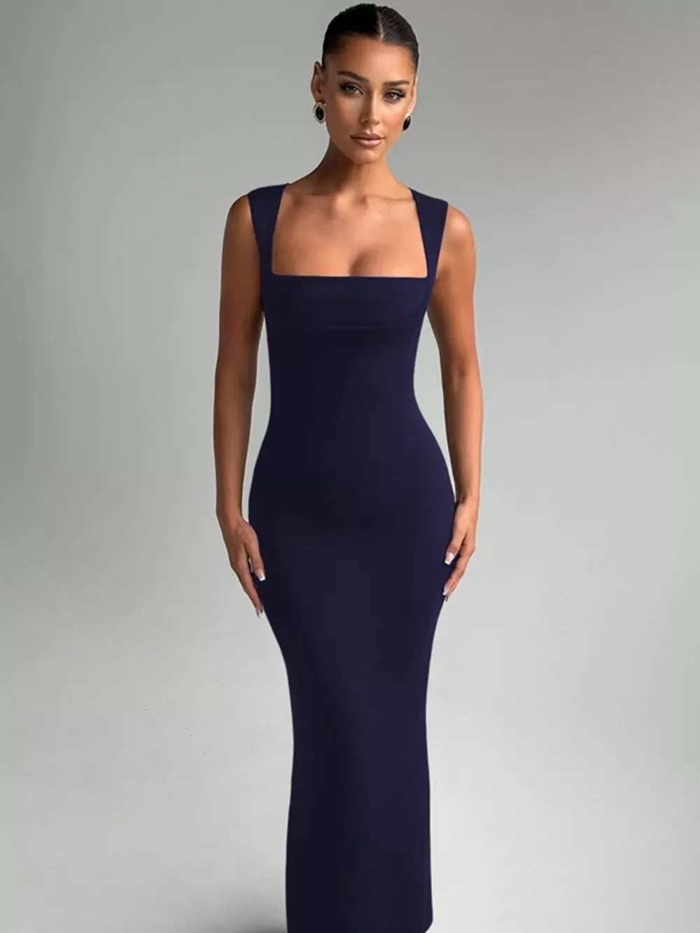 Navy blue bodycon maxi dress with square neckline and sleeveless cut.