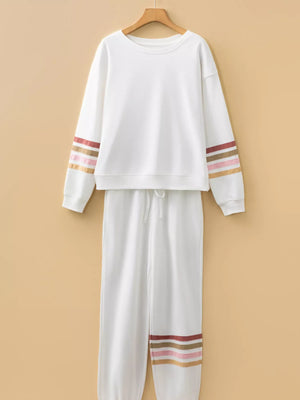 White loungewear set with striped sleeves and hem detail.