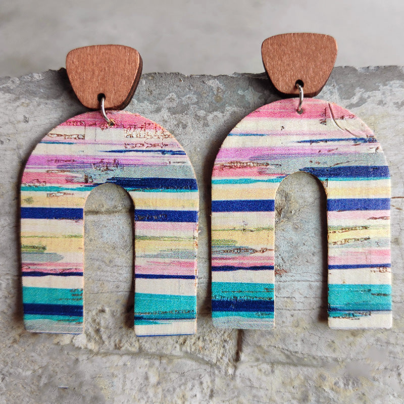 Archway cork statement earrings with colorful striped pattern and wooden top detail.
