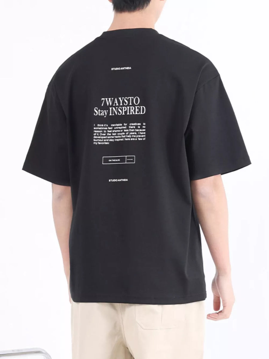 Black cotton blend crew neck t-shirt with white graphic text and logo on back.